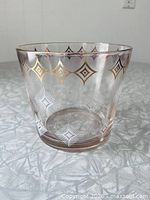 Full view of glass ice bucket showing pattern and shape