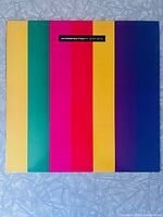 Front cover with vertical colour stripes and title