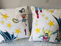 Front view of both superhero pillows