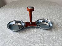 Full view of chrome double serving dish showing both trays and handle