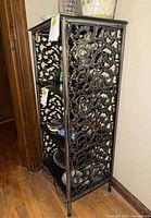 Side view showing metal scrollwork and overall shape