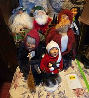 Group view of six Byers Choice caroler figurines on table