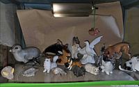 Overall view showing variety of animal figurines on shelf