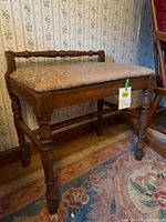 Overall front and side view of wooden bench showing design and condition