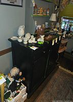 Full view of black buffet cabinet front with top surface