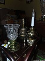 Three lamps grouped on table showing overall forms