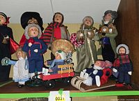 Group shot of all Byers Choice carolers and accessories on shelf