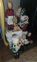 Group view of six Byers Choice caroler figures