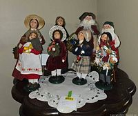 Group shot of all seven Byers’ Choice carolers on table