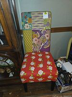 Front view of chair showing full upholstery and wooden legs