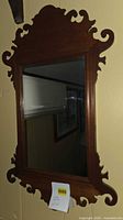 Full view of Chippendale-style wood framed mirror