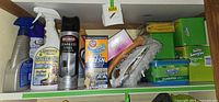 Overall view of shelf with all cleaning items