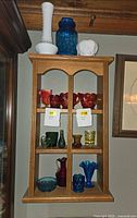 Wall shelf showing full assortment of coloured glass pieces