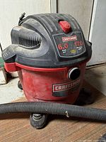Full view of Craftsman shop vac with hose attached