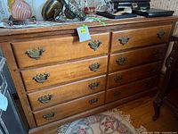 Front view of Dixie eight-drawer dresser showing hardware and form