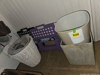 Group view of stools, wastebaskets and scale