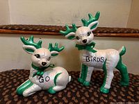 Both reindeer figurines displayed together