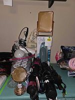 Full lot showing hair dryers, curling irons, mirrors, fan, rollers