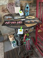 Group view of all decor items on and around metal table