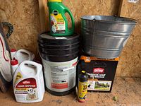 Group shot showing all chemical containers, bucket, pots and aerosol can