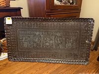 Full view of rectangular copper tray with engraved Egyptian scene