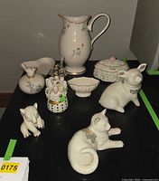 Full group of eight Lenox pieces on table