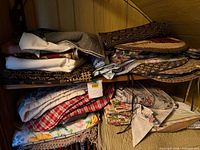 Shelf containing varied folded linens