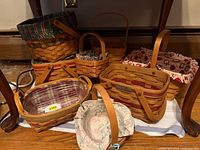 Group shot of all Longaberger baskets under table