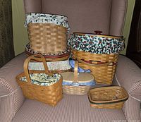 Group shot of all seven baskets displayed on chair