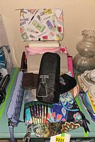 Overview of all pouches, wallets, hair comb, poncho and accessories