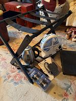 Overview showing luggage rack, kettle, fan, packaged hardware, step stool