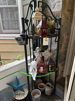 Full view of green metal corner shelf with contents (contents excluded)