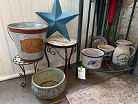 Full lot showing bucket planter, mosaic table, teal star, green planter, stoneware pieces
