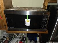 Front view of Panasonic microwave showing door and label