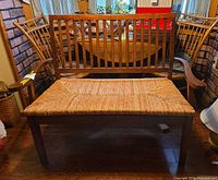 front view showing full bench frame and rush seat