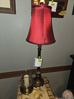 Full view of one table lamp with shade and base visible