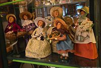 Full group of six Byers Choice spring carolers on display shelf