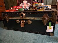 Front view of trunk showing lock, latch hardware and overall condition