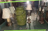 Overall view showing lamps, lantern, glass pieces and tealight holders