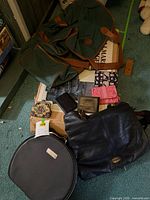 Group shot showing all bags, wallets and coin purse on floor