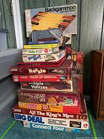 Full stack of boxed games including Backgammon board and Yahtzee pads