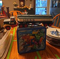 Hess Fuel Oils tanker truck on top of Spider-Man & Hulk lunchbox
