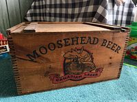 Front view showing Moosehead Beer Canadian Lager graphic and dovetail joints