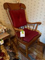 Full view of rocking chair showing cushions and overall style