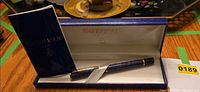 Fountain pen in open presentation case with booklet
