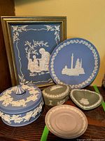 Group view showing all Wedgwood dishes and Lenox framed picture