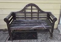 full front view of weathered wooden bench