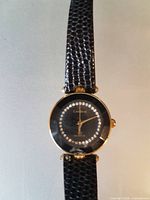 Round black dial Cardinal watch with black strap