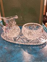 Pitcher, bowl and tray grouped to show matching cut pattern and scale