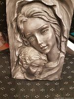 Front view of entire plaque showing relief design and size reference